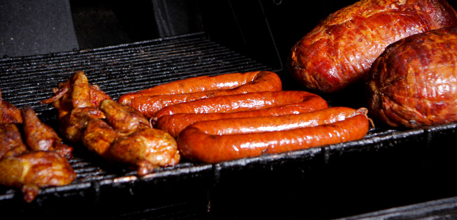 Sausage and smoked meats on the pit